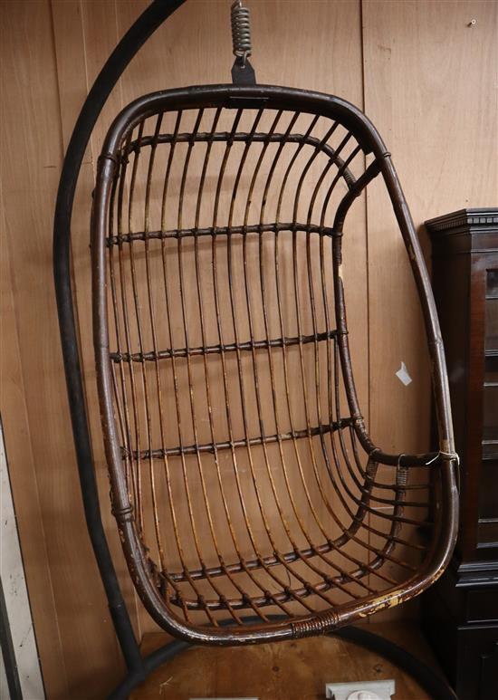 A bamboo hanging pod chair on iron frame H.176cm